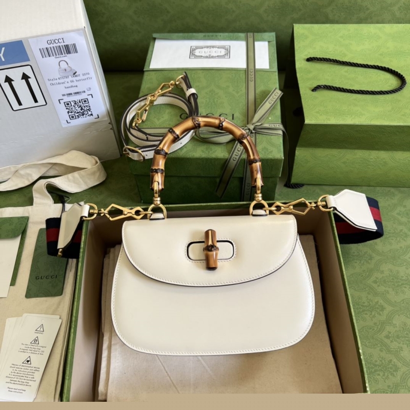 G*u*i top handle bags